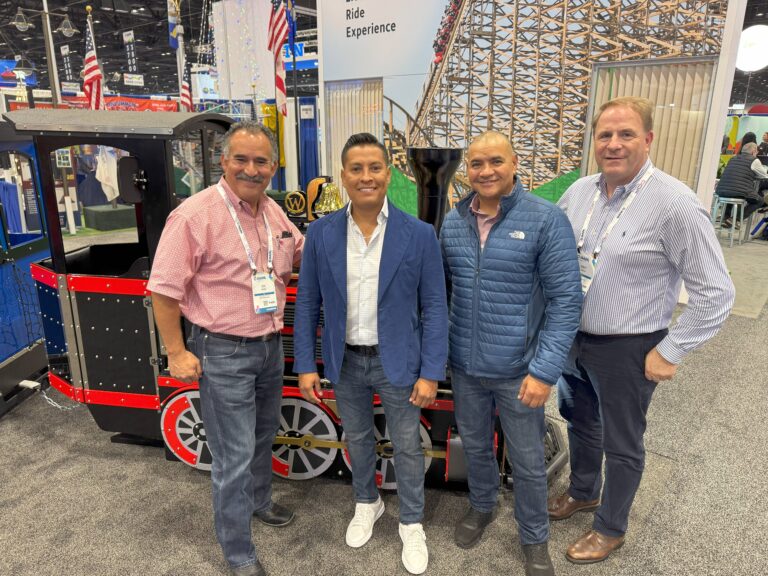 The Train Company USA sales team meeting with customers at IAAPA Expo