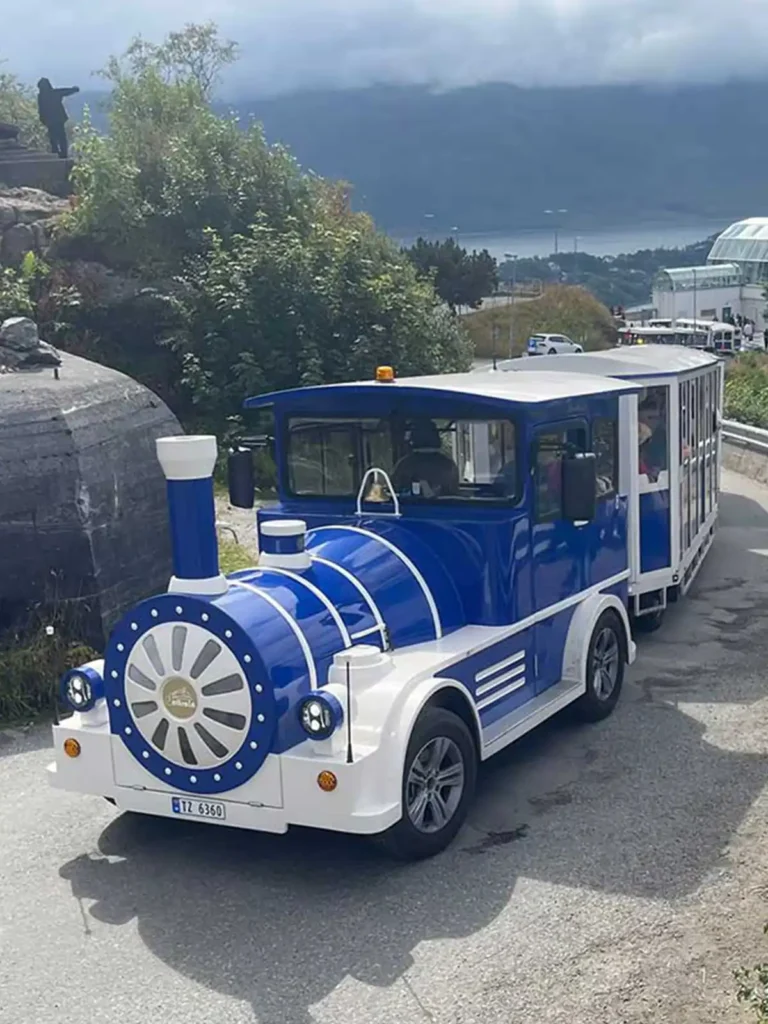 Deltrain Tagus EV electric tourist train driving uphill in a demanding operational environment