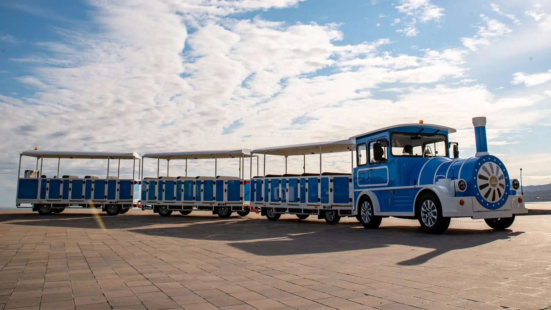 Deltrain Fresh tourist train with multiple open-air passenger wagons
