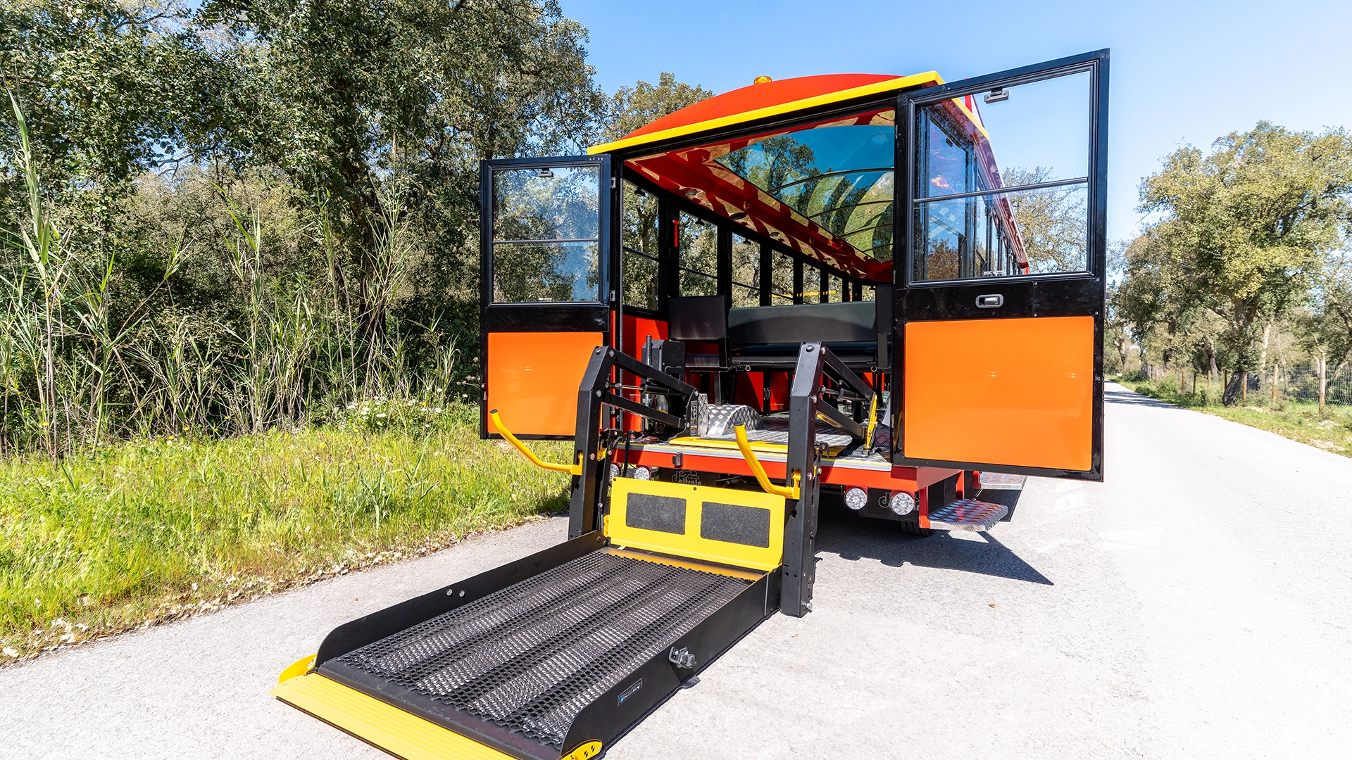 Rear of a Deltrain Prime enclosed wagon with the wheelchair boarding ramp lowered to ground level
