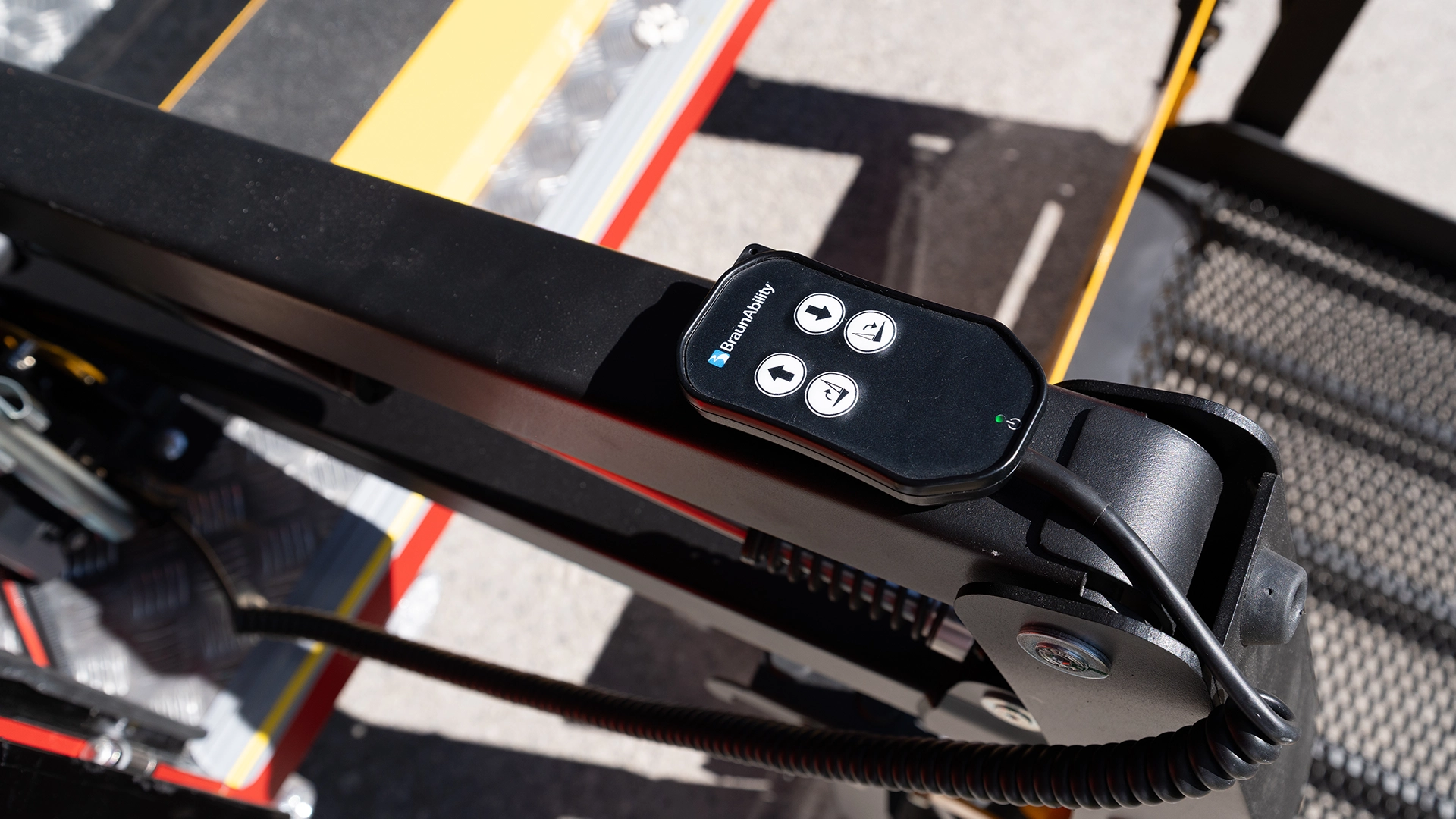 Handheld remote control operating the rear wheelchair ramp on a Deltrain Prime tourist train wagon