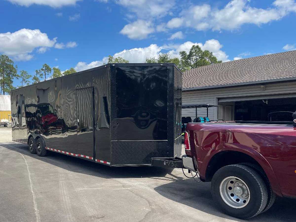TJ25 attraction train loaded in the optional enclosed transport trailer