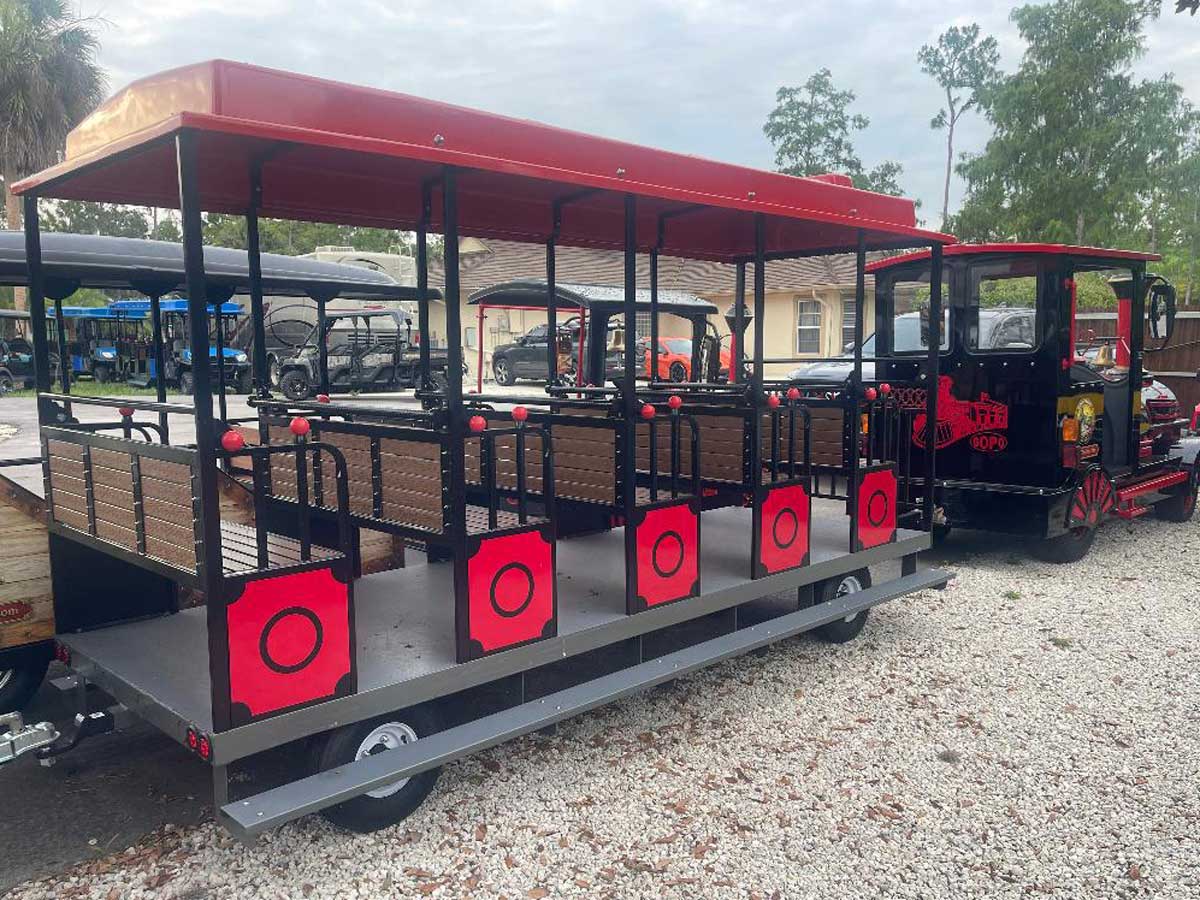 FL15 passenger coach with red roof and open sides for the TDK50 / TDJ50 train